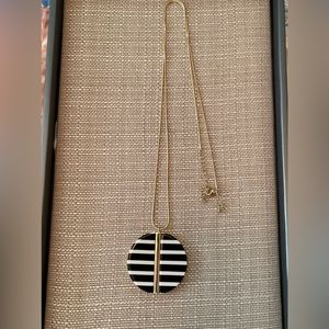 Black and white striped acrylic disc necklace. Gold tone chain. Never worn.